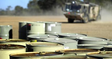 A RAAF Titan fire rescue vehicle responds to a practise fuel drum fire. Photo by Corporal Raymond Vance.