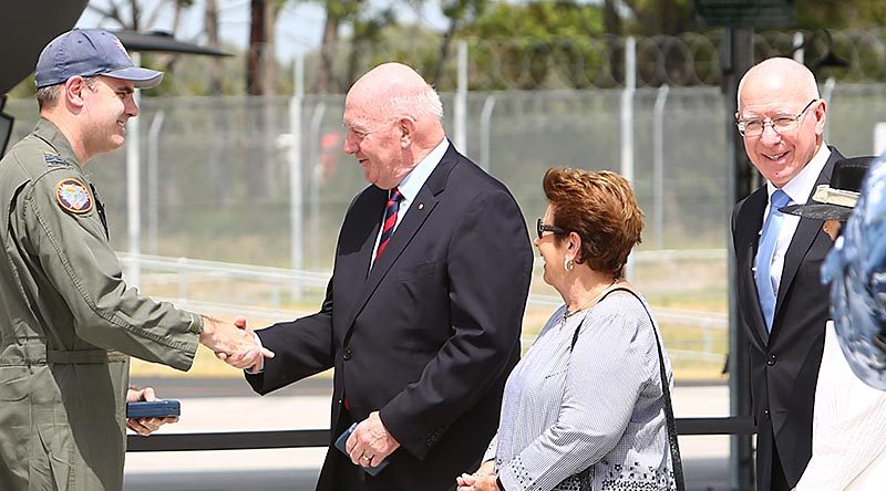 Governor General Sir Peter Cosgrove greets Wing Commander Darren Clare, Commanding Officer No 3 Squadron RAAF, after bring his F-35A Lightning home to Williamtown, NSW. Governor General Cosgrove is flanked by his wife Lyn and Governor of NSW General David Hurley – since named as Sir Peter's successor as Governor General. Photo by Brian Hartigan.