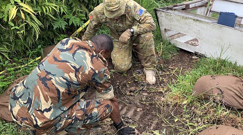 Explosive-ordnance-disposal specialists from the Vanuatu Mobile Force and the Australian Army prepare to destroy WWII ordnance in Vanuatu.