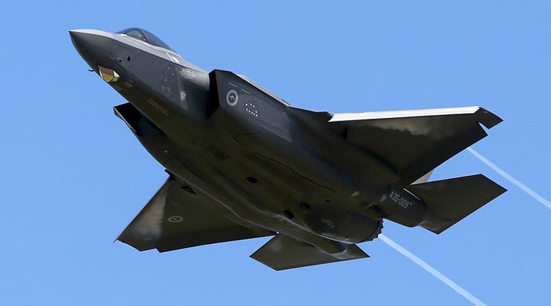 One of the first two Royal Australian Air Force F-35A Lightning Joint Strike Fighters flies overhead RAAF Base Williamtown on delivery day. Photo by Brian Hartigan.