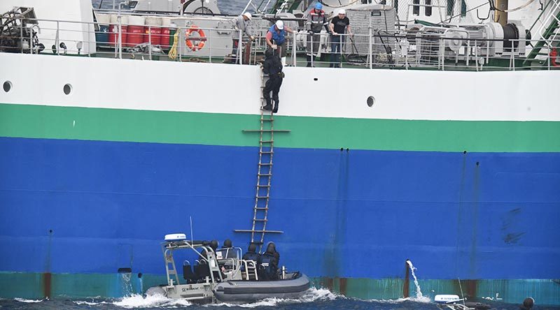 A fishery officer from New Zealand's Ministry for Primary Industries boards a commercial fishing vessel during joint patrols with the New Zealand Defence Force. NZDF photo.