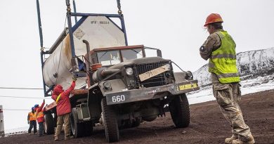 NZDF personnel move cargo containers at McMurdo Station. NZDF photo.