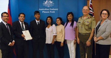 Cambodian interpreter Toch Rada with family and colleagues at the Australian Embassy in Phnom Penh.