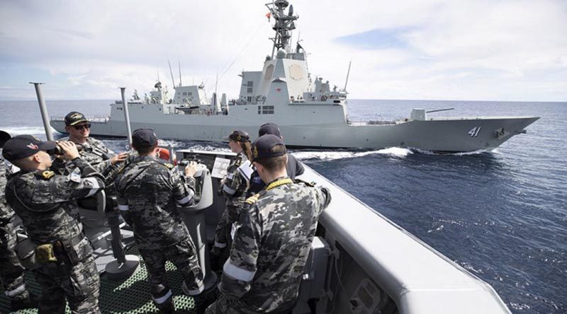 HMAS Melbourne's crew trial the prototype Maritime Multi-cam Pattern Uniform at sea, in company with HMAS Brisbane. Photo by Leading Seaman Kieran Dempsey