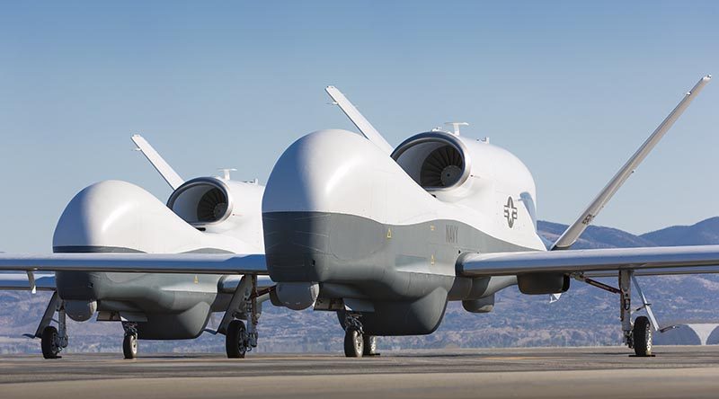 Two Northrop Grumman MQ-4C Tritons at a Northrop Grumman test facility in Palmdale, California. US Navy photo courtesy of Northrop Grumman by Chad Slattery.