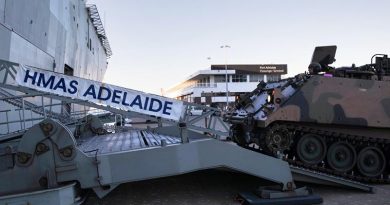 Vehicles from the 7th Battalion, Royal Australian Regiment embark HMAS Adelaide as part of an Amphibious Task Group at Port Adelaide, South Australia. Photo by Able Seaman Ryan McKenzie.