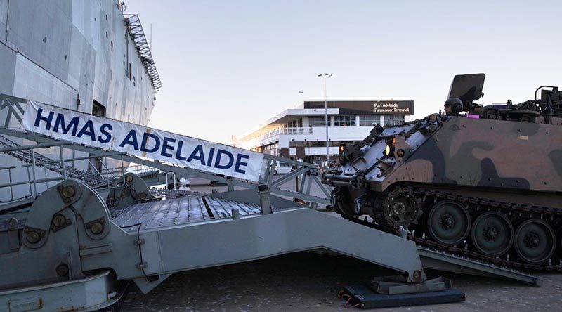 Vehicles from the 7th Battalion, Royal Australian Regiment embark HMAS Adelaide as part of an Amphibious Task Group at Port Adelaide, South Australia. Photo by Able Seaman Ryan McKenzie.