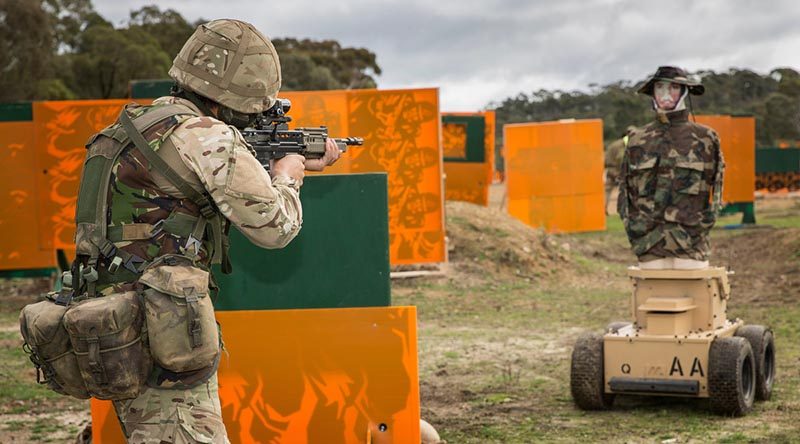 A British Army soldier engages a Marathon Targets robotic target during a close-quarter-engagement match at AASAM 2016. Photo by Sergeant Janine Fabre.