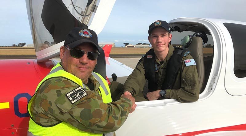 CWOFF Artyom Keddie is congratulated by Squadron Leader (AAFC) Scott Wiggins, Staff Officer Operations with Aviation Operations Wing, following his first solo powered flight in the new DA40 NG on 18 April 2019.