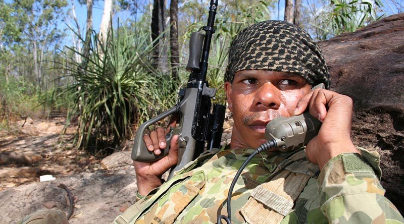 North West Mobile Force soldier Private Corinthian Noketta from the Wallman Community in Turkey Creek radios information to command elements during a patrol activity on Operation Resolute on Groote Eylandt in the Gulf of Carpentaria. Photo by Gunner Shannon Joyce. 24 year-old Private Corinthian joined NORFORCE in 2001 and works as a signaller and coax man on water patrols. Private Corinthian is a Community Dole Project (CDP) participant at home, but wants to get training as a ranger to do more for his land. When Private Corinthian returns from patrol, the first thing he plans to do is roll out his 1980 Falcon Fairmont for a cruise around Katherine. Private Corinthian plays Australian Rules Football for Klarno.