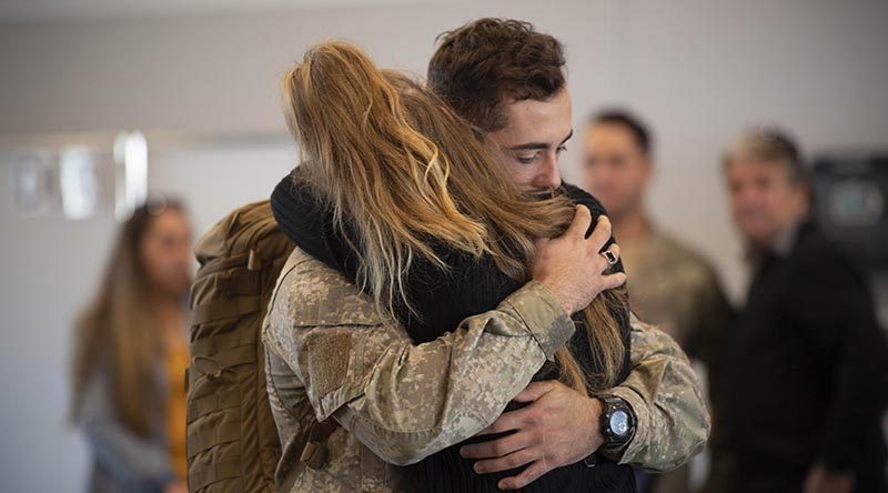 A New Zealand soldier bound for Operation Manawa 9 says good bye at RNZAF Base Ohakea Air Movements terminal. NZDF photo.