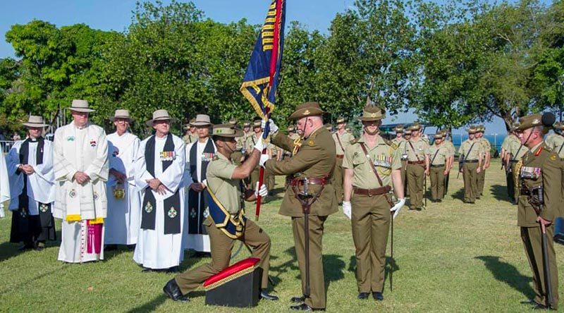 General Sir Peter Cosgrove, Governor General of Australia presents new Colours to 5RAR in Darwin, watched by Major General Mark Kelly, Colonel Commandant of The Royal Australian Regiment.