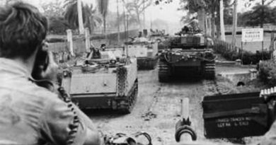 Centurion tanks from 1st Armoured Regiment, and armoured personnel carriers from B Squadron, 3rd Cavalry Regiment, move along the main road of Binh Ba village. Over three days, armour and infantry dislodged a strong North Vietnamese Army group that had entered the village, for the loss of one Australian killed in action. AWM BEL/69/0389/VN. Binh Ba.