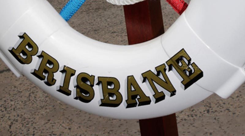 The Royal Australian Navy Guided Missile Destroyer HMAS Brisbane (III)’s ceremonial lifebuoy announcing the ship’s arrival at Hamilton wharf on the first visit to her namesake city. Photo by Corporal Colin Dadd.