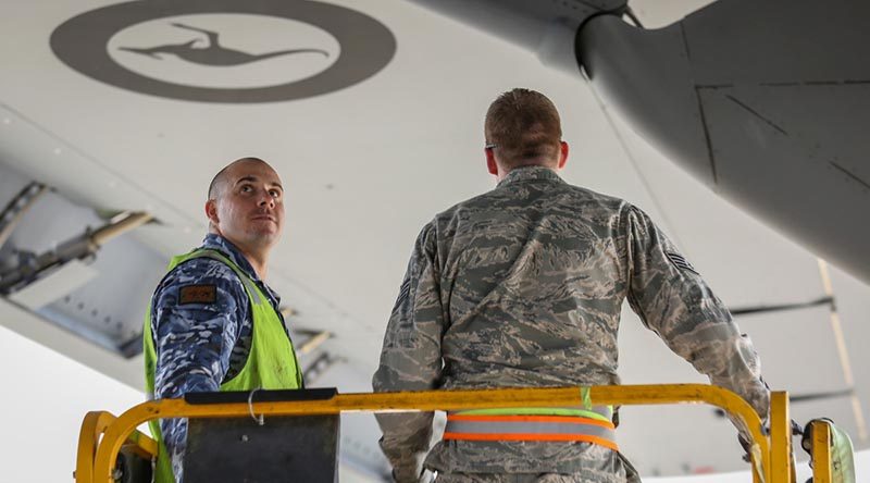 USAF and RAAF C-17 maintainers work together on a RAAF C-17A Globemaster III. Photo by Corporal Brenton Kwaterski.