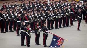 The Queen's Colour is lowered during the Royal Salute at the Royal Military College - Duntroon. Photo by Sergeant W Guthrie.