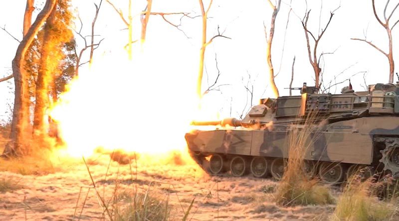 An Australian Army M1A1 Abrams fires in bushland at Shoalwater Bay Training Area, Queensland.