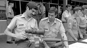 Then Major Greg Melick (left) and Lieutenant Colonel Don Blanksby examine a night-sight-equipped M-16 rifle at the Infantry Centre, Singleton. Photo by WO2 Craig Murphy.