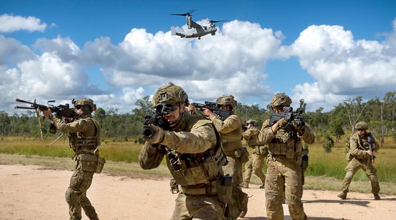 Australian Army riflemen from the 6th Battalion, Royal Australian Regiment, conduct a simulated assault with United States Marine Corps MV-22 Osprey support at Shoalwater Bay Training Area. Photo by Corporal Tristan Kennedy.