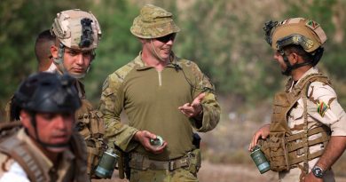 Australian Army officer Captain Jeremy Duff (centre), deployed with Task Group Taji 8, speaks with an Iraqi Army soldier before the Mission Rehearsal Exercises at the Taji Military Complex. Photo by Corporal Oliver Carter.