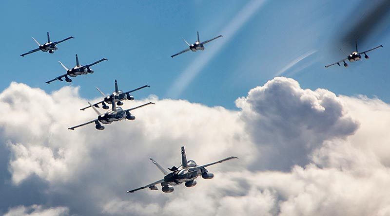 F/A-18A Hornets from No.77 Squadron at RAAF Base Williamtown in formation to celebrate the unit's 77th anniversary. Photo by Corporal Craig Barrett.