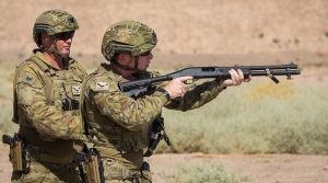 Sergeant Nicholas Cope supervises Private Richard Collins during a shotgun familiarisation serial at Taji Military Complex, Iraq. Photo by Corporal Nunu Campos.