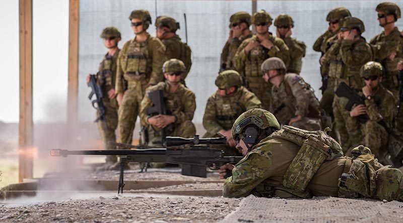 Australian Army Corporal Bradley Rawnsley, deployed with Task Group Taji 9, fires an AW50 sniper rifle during weapons familiarisation drills at the Taji Military Complex, Iraq. Photo by Corporal Nunu Campos.