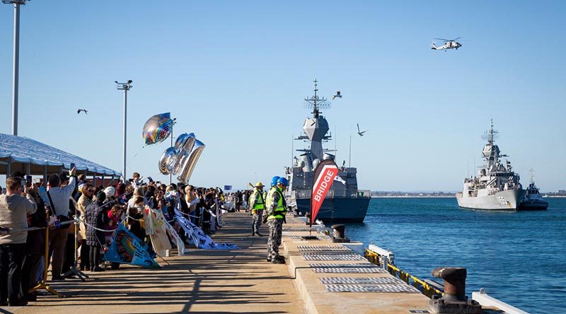 Families and friends welcome home HMAS Ballarat at Fleet Base West, Western Australia, after her nine-month deployment on Operation Manitou. Photo by Leading Seaman Kylie Jagiello.