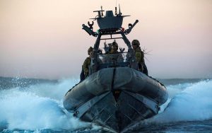 2nd Commando Regiment commandos speed towards a 'target' vessel in a rigid-hulled inflatable boat (RHIB) during counter-terrorism training off the New South Wales coast. Photo by Corporal Sebastian Beurich.