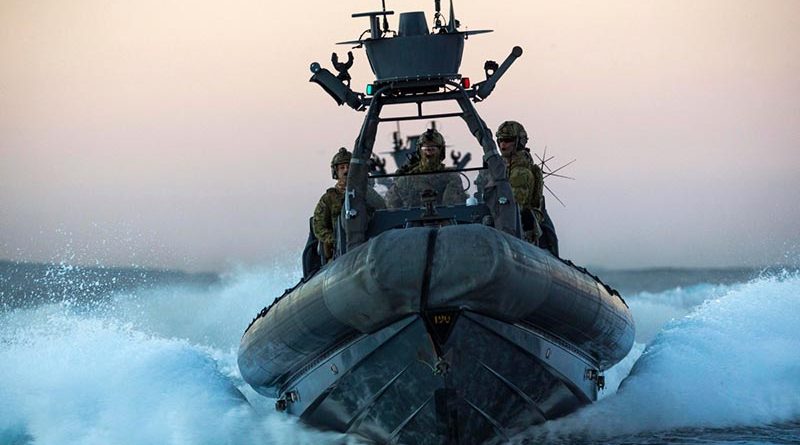 2nd Commando Regiment commandos speed towards a 'target' vessel in a rigid-hulled inflatable boat (RHIB) during counter-terrorism training off the New South Wales coast. Photo by Corporal Sebastian Beurich.