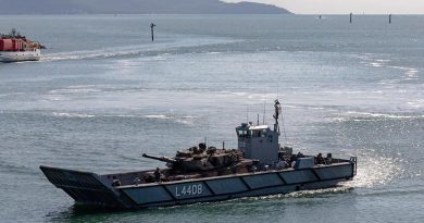 An LHD landing craft carries an M1A1 Abrams tank in Townsville Harbour during post-upgrade trials. Royal Australian Navy Photo.