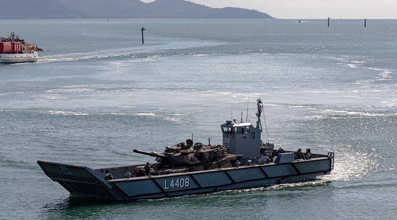 An LHD landing craft carries an M1A1 Abrams tank in Townsville Harbour during post-upgrade trials. Royal Australian Navy Photo.