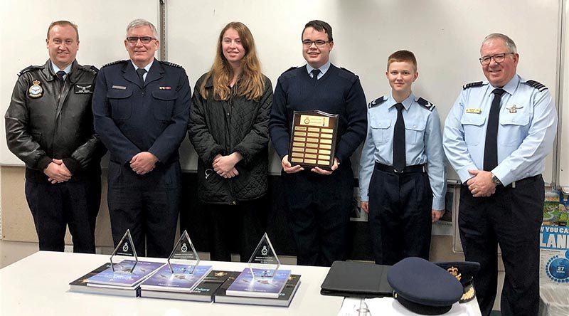 CAPTION: The “Fly High Sci Fi” team from 617 Squadron receive their National Aerospace Competition award (left to right): FLGOFF(AAFC) Chris Trewin (Commanding Officer, 617 Squadron), GPCAPT Warren Bishop (Competition Manager), LCDT Stephanie Hudson, CWOFF Ian van Schalkwyk, CCPL James Armfield and WGCDR(AAFC) Patrick Pulis (Officer Commanding, 6 Wing). Image supplied by Air Force.