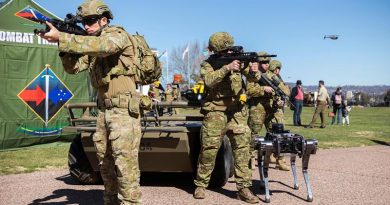 Australian Army soldiers from the Combat Training Centre are joined by Mule (rear) and Ghostrobotics (right) unmanned ground vehicles, as well as a Black Hornet nano UAV in a display of human-machine teaming during Army Demonstration Day at Russel Offices. Photo by Corporal Sebastian Beurich.