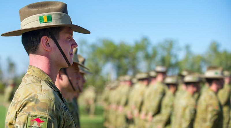 A 5th Battalion, Royal Australian Regiment, soldier stands at ease during a farewell parade for troops heading to the Middle East, at Robertson Barracks, NT. Photo by Corporal Carla Armenti.