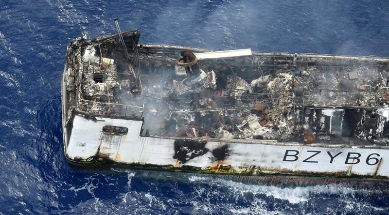 A Royal New Zealand Air Force P-3K2 Orion photographs the Chinese fishing vessel Jin Xiang 6, damaged by fire west of Tuvalu. NZDF photo.