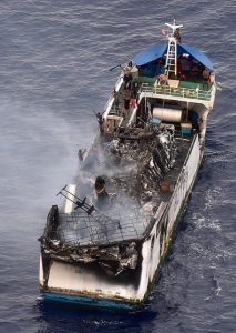 A Royal New Zealand Air Force P-3K2 Orion photographs the Chinese fishing vessel Jin Xiang 6, damaged by fire west of Tuvalu. NZDF photo.