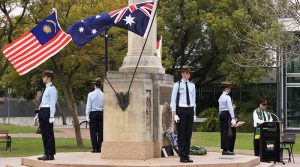 SA/NT Branch NMBVAA Padre Salvation Army Major Quentin Castle officiates at the Adelaide Malaya-Borneo Veterans Day ceremony, with local Australian Air Force Cadets performing ceremonial duties. Photo by Major (ret’d) Paul Rosenzweig.