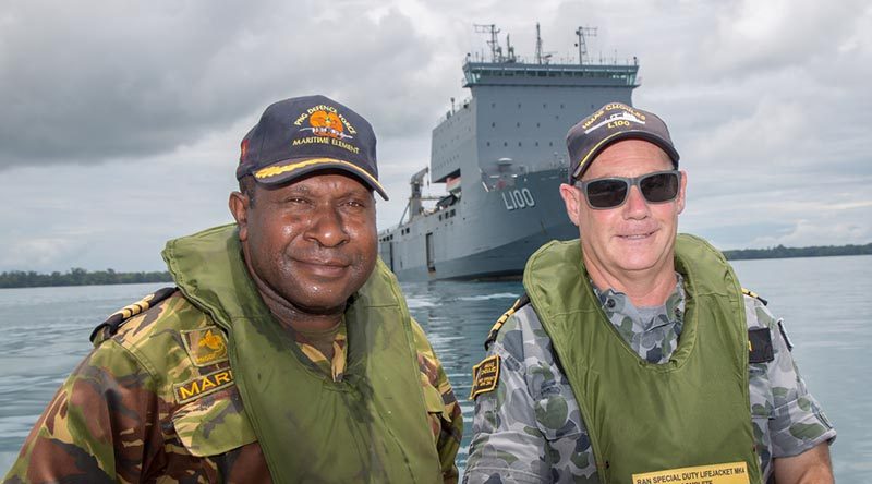 Commander Sebastian Marru of the Papua New Guinea Defence Force Maritime Element, and the Commanding Officer HMAS Choules Commander Scott Houlihan at Tarangau Naval base, Manus Island. Photo by Petty Officer Justin Brown.