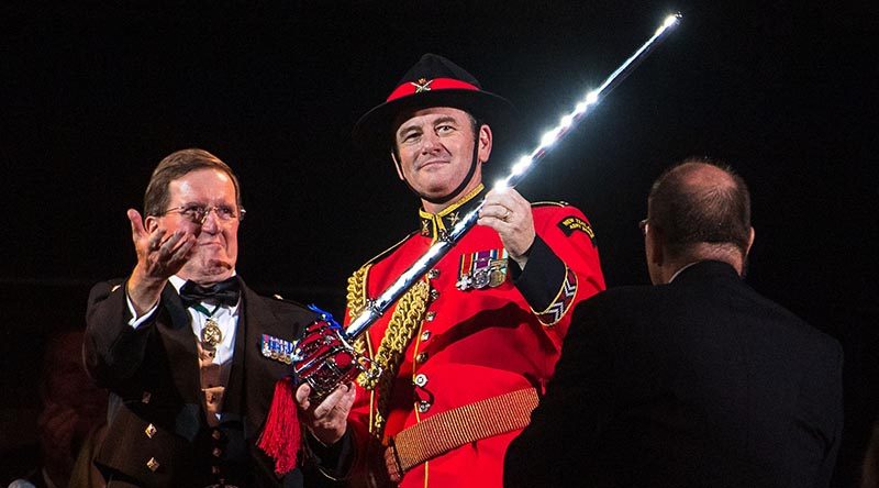 Major Graham Hickman of the New Zealand Army Band, right, receives the Pooley Sword at the final show of the 2019 Royal Edinburgh Military Tattoo. Photo courtesy The Royal Edinburgh Military Tattoo.