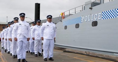 Samoan Police crew of Nafanua II fall in alongside their newly aquired Guardian-class patrol boat at Austal ship yards in Henderson, Western Australia. Photo by Leading Seaman Richard Cordell.