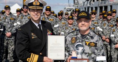 Chief of Navy, Vice Admiral Michael Noonan presents Warrant Officer Paul Ross with a Commendation and Innovation award in front Submarine Force personnel on Diamantina Pier at Fleet Base West, Western Australia. Photo by Leading Seaman Richard Cordell.