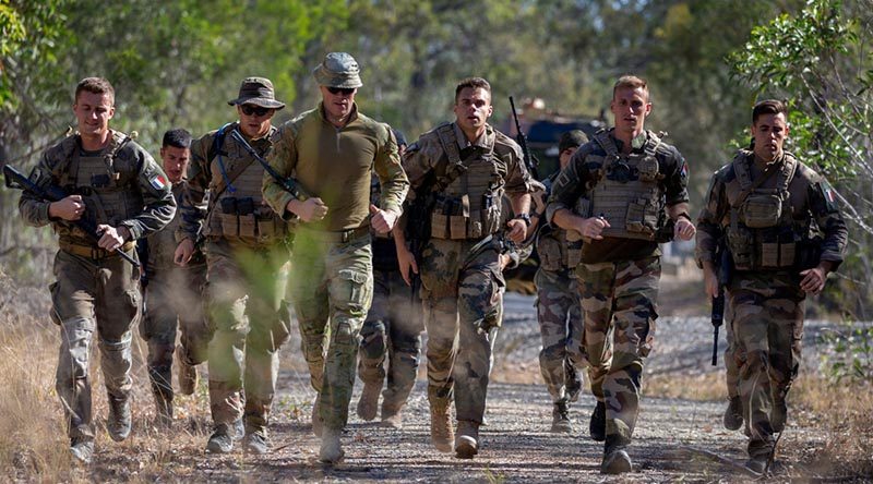 Soldiers from the New Caledonian Armed Forces run in an endurance event, with an Australian Army officer as their observer, during Exercise Hydra 2019 at Greenbank Training Area, Queensland, Australia. Photo by Gunner Sagi Biderman.