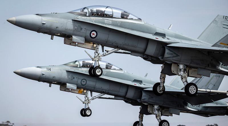 Two Royal Australian Air Force F/A-18 Hornets take off at Avalon, Victoria. Photo by Corporal Jessica de Rouw.