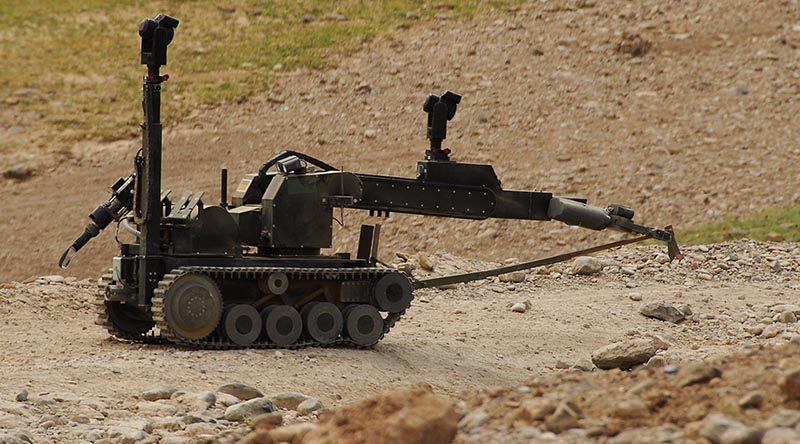 A remote control robot, operated by Australian Engineers from the 1st Mentoring and Reconstruction Task Force moves in, to deal with an improvised explosive device, which the Australian troops uncovered during Operation Zamarai Silawel. Photo by Corporal Ricky Fuller.