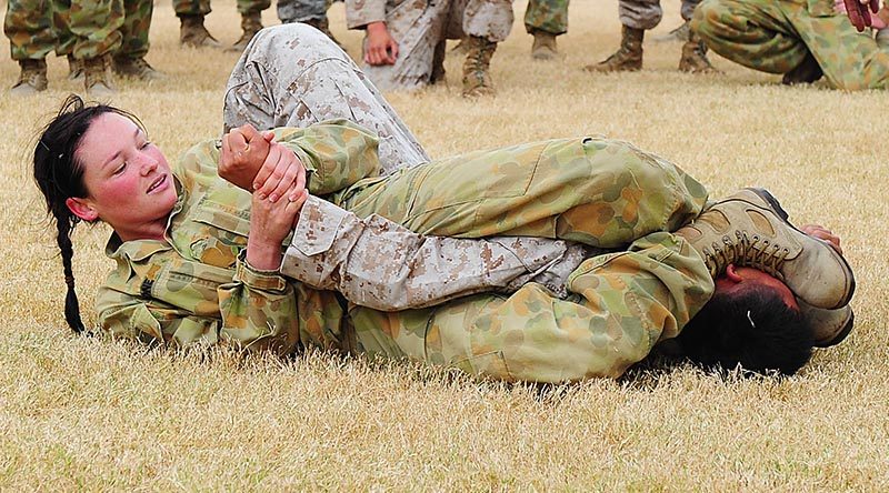 Australian Army Corporal Casey Bone, 1st Aviation Regiment, gets the upper-hand on a US Marine Corps opponent during the unarmed combat practise during Exercise Talisman Sabre 2011. Photo by Leading Seaman Andrew Dakin.