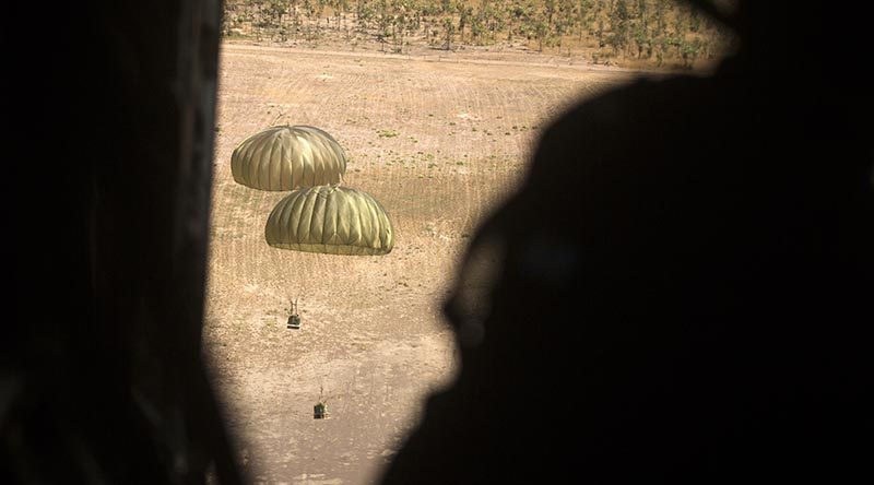 A RAAF C-27J Spartan drops Australian Aid onto the Mount Bundey Training Area during Exercise Crocodile Response, NT, Australia. Photo by Staff Sergeant Jordan Gilbert.