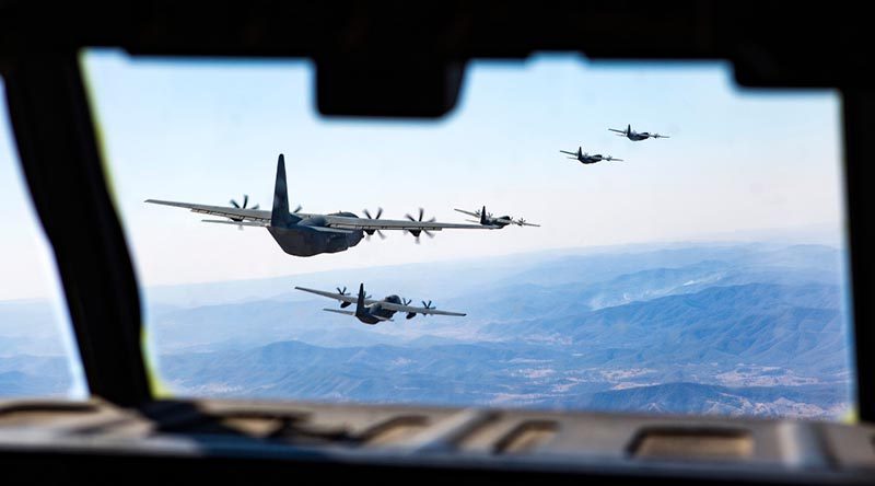 Five No 37 Squadron C-130J Hercules fly in formation to celebrate 20 years of C-130J operations in Australia. Photo by Corporal David Said.