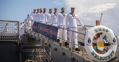 HMAS Melbourne's ship's company march off the ship for the last time, during her decommissioning ceremony at Fleet Base East in Sydney. Photo by Leading Aircraftman John Solomon.