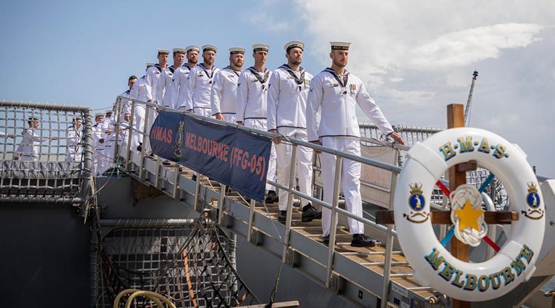 HMAS Melbourne's ship's company march off the ship for the last time, during her decommissioning ceremony at Fleet Base East in Sydney. Photo by Leading Aircraftman John Solomon.